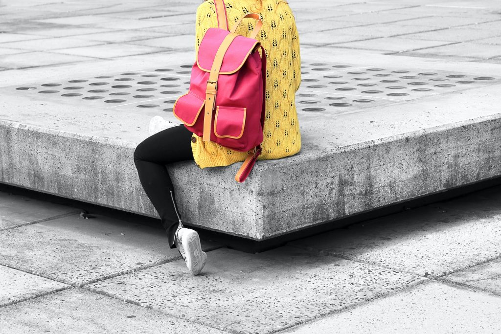 photo of woman with pink backpack