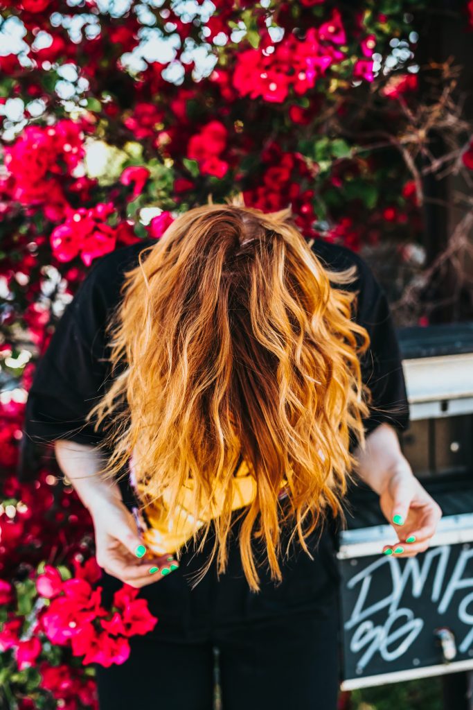 photo of woman with wavy hair upside down