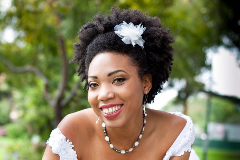 photo of woman with curly hair on her wedding